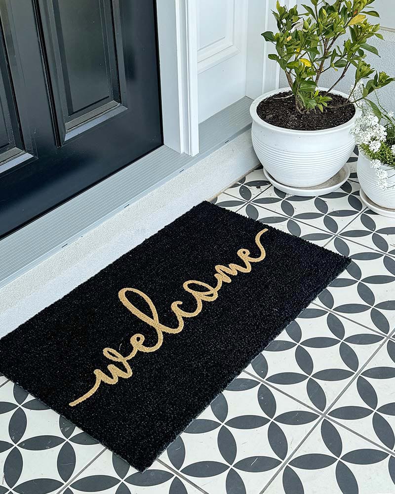 Cursive Welcome - Embossed Black Tan