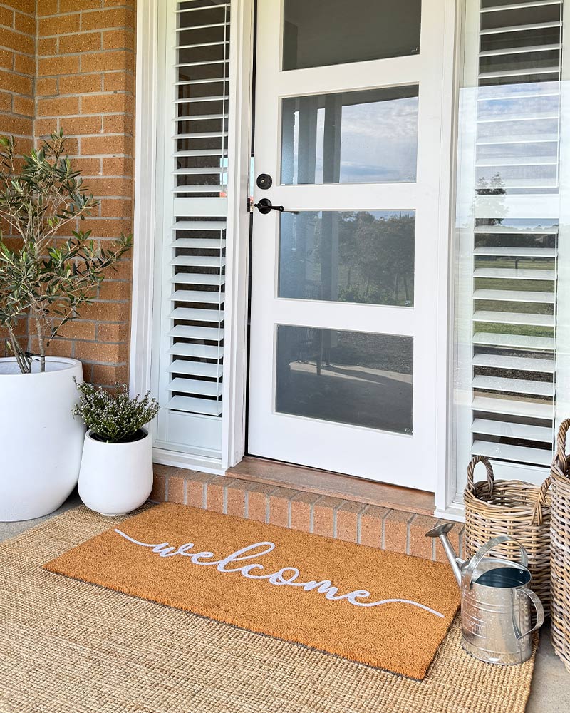 Cursive Welcome - White Embossed Coir Doormat