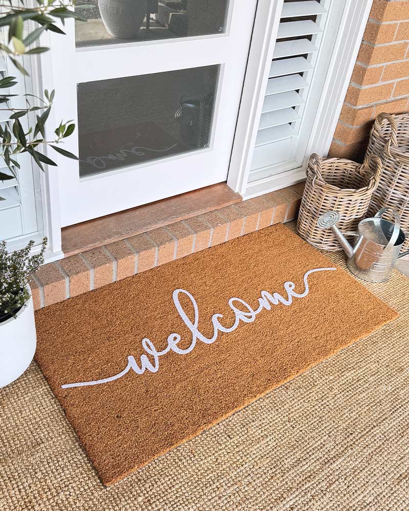 Cursive Welcome - White Embossed Coir Doormat