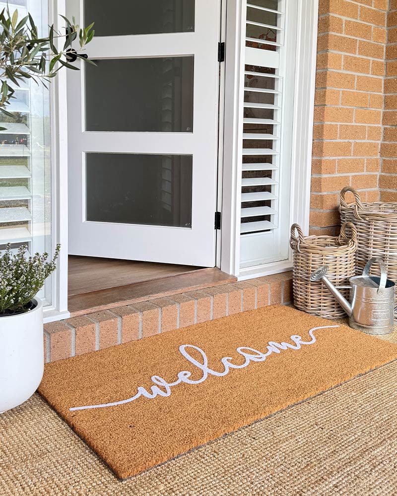 Cursive Welcome - White Embossed Coir Doormat